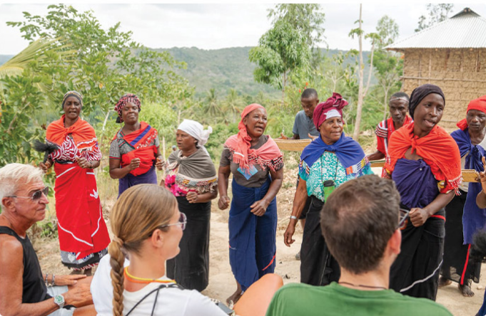 Visitors meeting members of a coastal community near Diani Beach